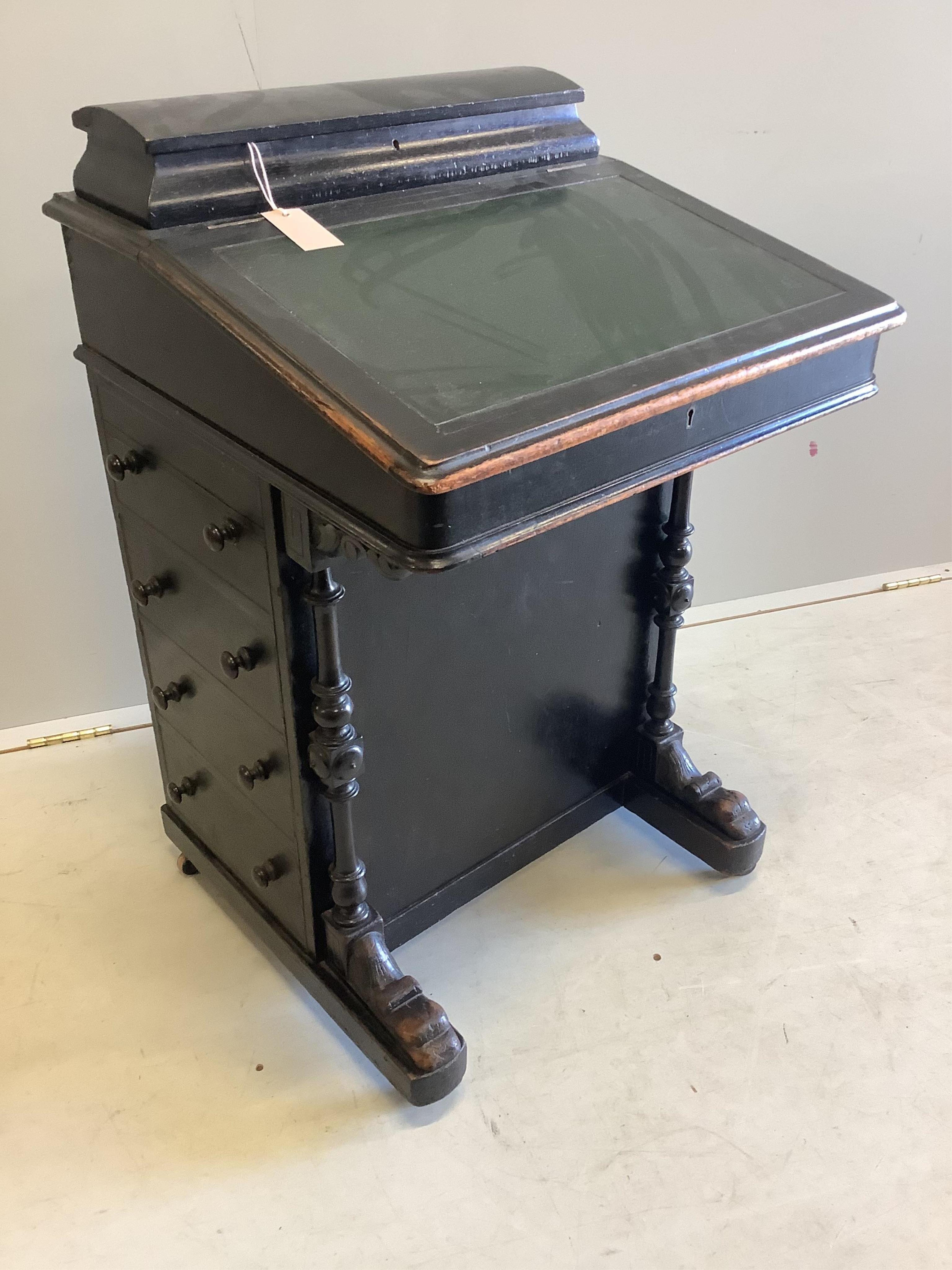 A late Victorian ebonised Davenport, width 53cm, depth 53cm, height 83cm. Condition - fair